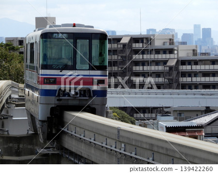 A train arriving at Hotarugaike Station on the Osaka Monorail. A train arriving at Hotarugaike Station on the Osaka Monorail. 139422260