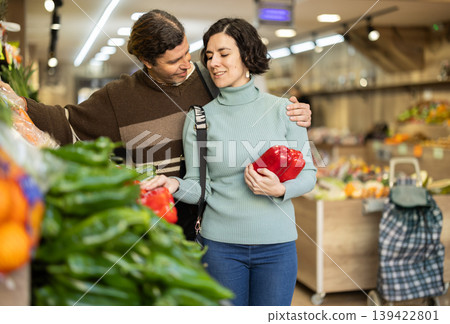 Couple buying bell peppers 139422801