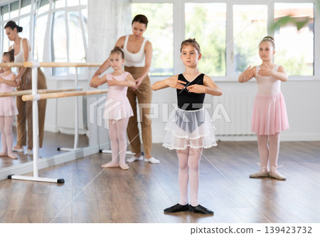 Group of girls standing in first position 139423732