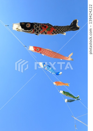 Carp streamer swimming in the blue sky Carp streamer swimming in the blue sky 139424222
