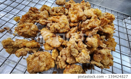 Crispy Golden Brown Deep Fried Chicken Pieces on Cooling Wire Rack Crispy Golden Brown Deep Fried Chicken Pieces on Cooling Wire Rack 139424827