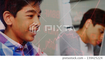 Two teenage boys wearing checkered shirt and grey tee studying in study space, stock chart overlay Two teenage boys wearing checkered shirt and grey tee studying in study space, stock chart overlay 139425224