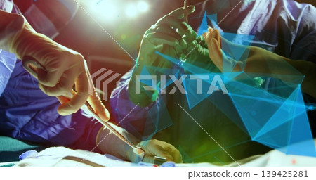 Manipulating surgeons' gloved hands using scalpel on draped torso under OR lamp, with retractors 139425281