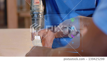 Drilling mentor guiding apprentice at workshop bench, with power drill, wooden block and AR overlay Drilling mentor guiding apprentice at workshop bench, with power drill, wooden block and AR overlay 139425299