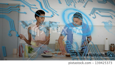 Woman and man preparing vegetables in kitchen, wiping marble countertop with AR overlay Woman and man preparing vegetables in kitchen, wiping marble countertop with AR overlay 139425373