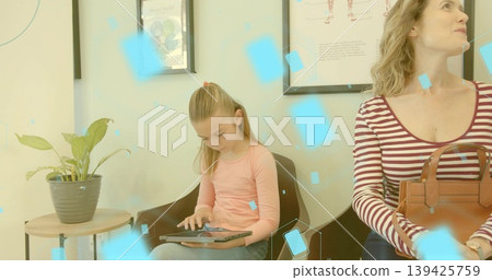 Child girl tapping tablet in clinic waiting area, mother holding leather handbag, copy space Child girl tapping tablet in clinic waiting area, mother holding leather handbag, copy space 139425759
