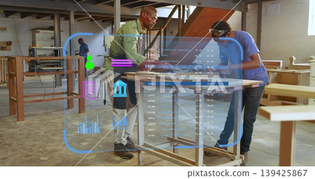 Two carpenters inspecting panel on bench in shop, with measuring tape and holographic overlay Two carpenters inspecting panel on bench in shop, with measuring tape and holographic overlay 139425867