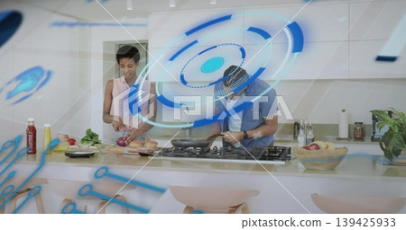 Preparing friends chopping onion and stirring skillet at kitchen island, with AR graphics Preparing friends chopping onion and stirring skillet at kitchen island, with AR graphics 139425933