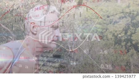 Jogging senior male runner wearing sleeveless top on wooded trail, with chart overlays, copy space 139425977