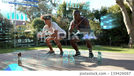 Performing low squats two men in athletic clothing and sneakers on backyard deck with HUD overlays Performing low squats two men in athletic clothing and sneakers on backyard deck with HUD overlays 139426087