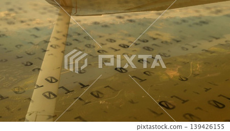 Metal wing support strut resting beside airplane window inside light aircraft, with binary overlay Metal wing support strut resting beside airplane window inside light aircraft, with binary overlay 139426155