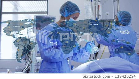 Surgical team holding anesthesia mask, adjusting IV bag, monitoring tubing in operating room Surgical team holding anesthesia mask, adjusting IV bag, monitoring tubing in operating room 139426254