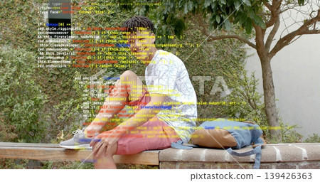 Tying laces teenage boy sitting on brick bench in garden, with blue backpack and brown book Tying laces teenage boy sitting on brick bench in garden, with blue backpack and brown book 139426363
