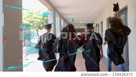 Hurrying four graduates wearing black gowns and caps along colonnade, hologram display showing code Hurrying four graduates wearing black gowns and caps along colonnade, hologram display showing code 139426375