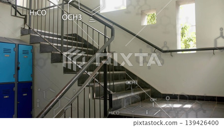 Featuring U-shaped grey tiled staircase in lab stairwell, with blue lockers and chemical formulas Featuring U-shaped grey tiled staircase in lab stairwell, with blue lockers and chemical formulas 139426400