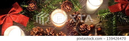 Warm Christmas background image with lit candles Warm Christmas background image with lit candles 139426470