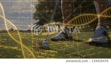 Lining up golfer's putt on putting green at golf course, with golf ball, digital DNA overlays Lining up golfer's putt on putting green at golf course, with golf ball, digital DNA overlays 139426476