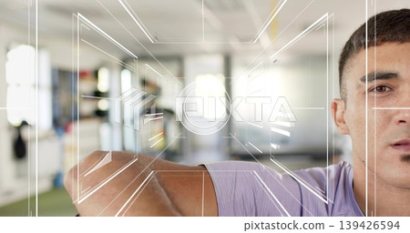Raising man showing right-side face, arm crossing at gym in purple tee, HUD overlay, copy space Raising man showing right-side face, arm crossing at gym in purple tee, HUD overlay, copy space 139426594