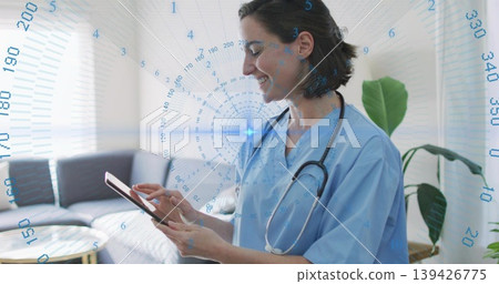 Smiling nurse in scrubs tapping tablet screen in living room with stethoscope overlay, copy space Smiling nurse in scrubs tapping tablet screen in living room with stethoscope overlay, copy space 139426775
