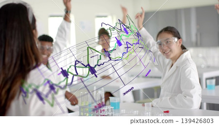 Students in lab coats and goggles gathering in science lab, handling test tube rack and beakers Students in lab coats and goggles gathering in science lab, handling test tube rack and beakers 139426803