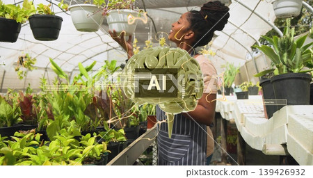 Inspecting woman wearing striped apron checking hanging white planter at nursery bench, AI overlay Inspecting woman wearing striped apron checking hanging white planter at nursery bench, AI overlay 139426932