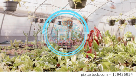 Displaying assorted potted plants and seedling trays inside greenhouse, showing AR graphic overlay 139426934