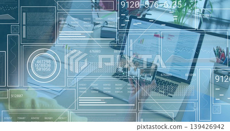 Displaying open laptop showing charts at desk with HUD and team wearing business-casual Displaying open laptop showing charts at desk with HUD and team wearing business-casual 139426942