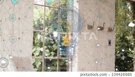 Projecting holographic lightbulb over wooden window and coat hooks in sunroom, with network icons Projecting holographic lightbulb over wooden window and coat hooks in sunroom, with network icons 139426980