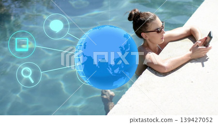 Leaning woman checking smartphone at pool, wearing swimsuit, sunglasses, digital icons, copy space Leaning woman checking smartphone at pool, wearing swimsuit, sunglasses, digital icons, copy space 139427052