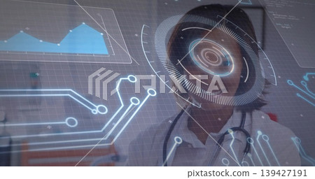 Studying woman in white lab coat examining holographic HUD in clinic, stethoscope visible Studying woman in white lab coat examining holographic HUD in clinic, stethoscope visible 139427191