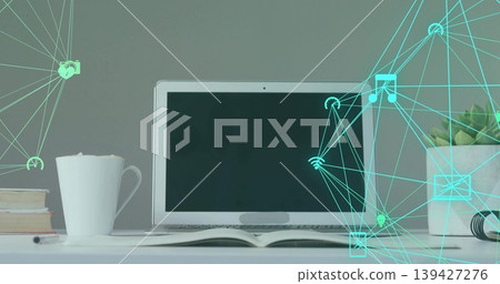 Showing centered laptop resting on white tabletop with open book, coffee mug, teal overlay Showing centered laptop resting on white tabletop with open book, coffee mug, teal overlay 139427276