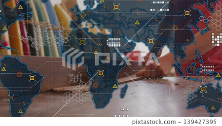 Leaning male wearing red pointing at papers on wooden desk with organizer, map overlay, copy space Leaning male wearing red pointing at papers on wooden desk with organizer, map overlay, copy space 139427395