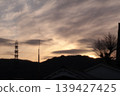 A quiet evening descends upon the foothills. A calm sky signals the end of the day. 139427425