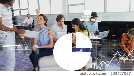 Handing printed sheet, standing man briefing seated team in open lounge, woman holding green bottle Handing printed sheet, standing man briefing seated team in open lounge, woman holding green bottle 139427927