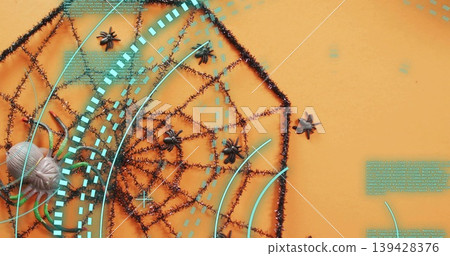 Displaying black tinsel spider web on orange backdrop, showing small spiders and cyan HUD overlays Displaying black tinsel spider web on orange backdrop, showing small spiders and cyan HUD overlays 139428376
