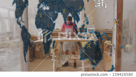 Sanding worker wearing respirator mask, apron using sander on board atop sawhorses with HUD overlay Sanding worker wearing respirator mask, apron using sander on board atop sawhorses with HUD overlay 139428580