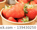 Lots of fresh strawberries in a cup 139430250