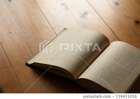 A book opened on the desk A book opened on the desk 139431058