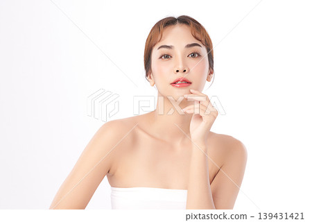 A beautiful young Asian woman with clean, fresh skin against a white background. Skincare, facial treatment, cosmetology, beauty, and spa. An elegant portrait of an Asian woman. A beautiful young Asian woman with clean, fresh skin against a white background. Skincare, facial treatment, cosmetology, beauty, and spa. An elegant portrait of an Asian woman. 139431421