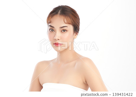 A beautiful young Asian woman with clean, fresh skin against a white background. Skincare, facial treatment, cosmetology, beauty, and spa. An elegant portrait of an Asian woman. 139431422