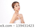 A beautiful young Asian woman with clean, fresh skin against a white background. Skincare, facial treatment, cosmetology, beauty, and spa. An elegant portrait of an Asian woman. 139431423