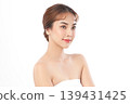 A beautiful young Asian woman with clean, fresh skin against a white background. Skincare, facial treatment, cosmetology, beauty, and spa. An elegant portrait of an Asian woman. 139431425
