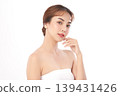 A beautiful young Asian woman with clean, fresh skin against a white background. Skincare, facial treatment, cosmetology, beauty, and spa. An elegant portrait of an Asian woman. 139431426
