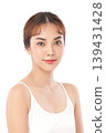 A beautiful young Asian woman with clean, fresh skin against a white background. Skincare, facial treatment, cosmetology, beauty, and spa. An elegant portrait of an Asian woman. 139431428