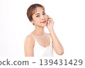 A beautiful young Asian woman with clean, fresh skin against a white background. Skincare, facial treatment, cosmetology, beauty, and spa. An elegant portrait of an Asian woman. 139431429