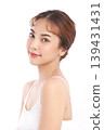 A beautiful young Asian woman with clean, fresh skin against a white background. Skincare, facial treatment, cosmetology, beauty, and spa. An elegant portrait of an Asian woman. 139431431