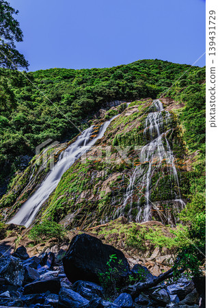 The Okawa Waterfall flows through the lush green island of Yakushima. The Okawa Waterfall flows through the lush green island of Yakushima. 139431729