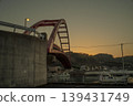 A bridge at dusk and a quiet harbor 139431749