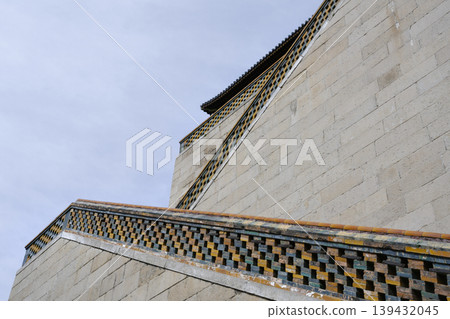 Staircase railing with ceramic blocks leads to Buddhist Foxiange Temple in Yiheyuan Park in Beijing Staircase railing with ceramic blocks leads to Buddhist Foxiange Temple in Yiheyuan Park in Beijing 139432045