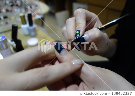 Nail Artist Creating Detailed Nail Art Design Nail Artist Creating Detailed Nail Art Design 139432327